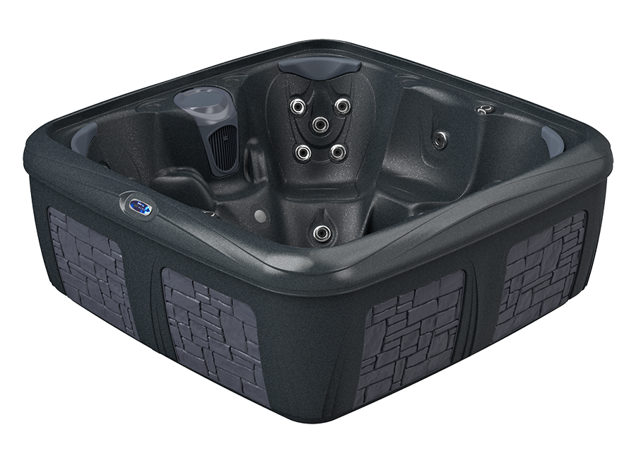 Dark gray hot tub with brick-like exterior panels, multiple jets, and a molded interior.