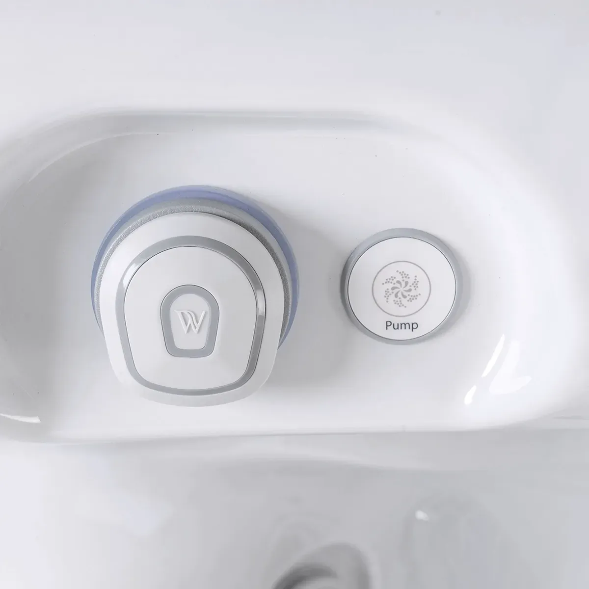 White hot tub interior with two controls, one labeled 