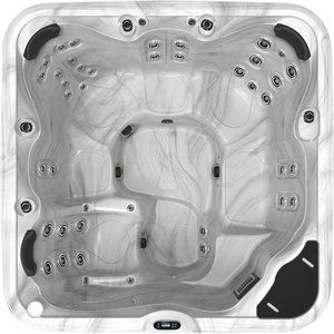 Overhead view of a gray and white marble-patterned hot tub with multiple seating areas and jet nozzles.