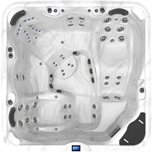 Overhead view of a large, white hot tub with multiple jet configurations.