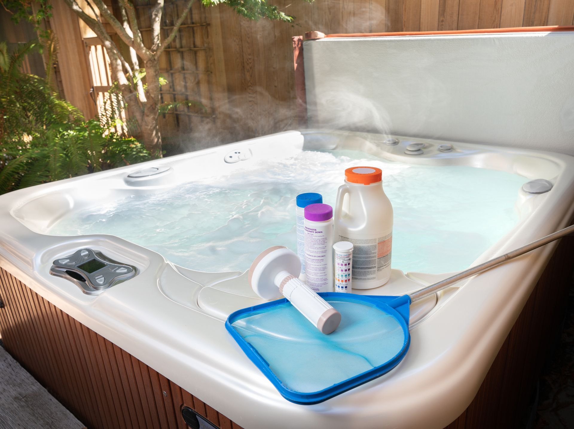 Swim spa chemicals for water treatment with bromine float and skim screen from Half Price Hot Tubs.