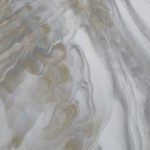 Swirling marbled pattern in shades of white, gray, and gold.