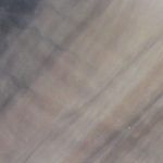 Swirling shades of gray and brown, creating an abstract textured background.