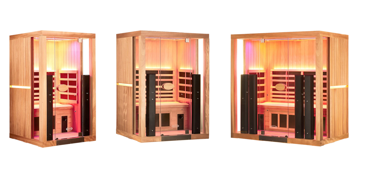 Three wooden sauna units, lit with colorful interior lighting, set against a white backdrop.