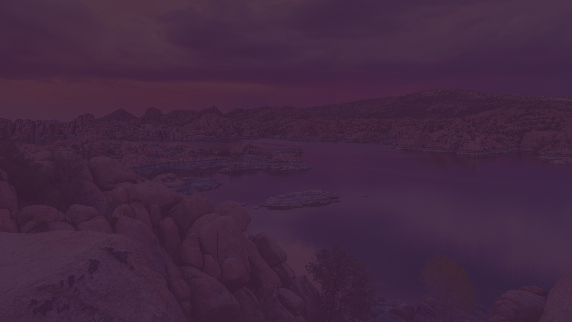 A purple background with a landscape in the background