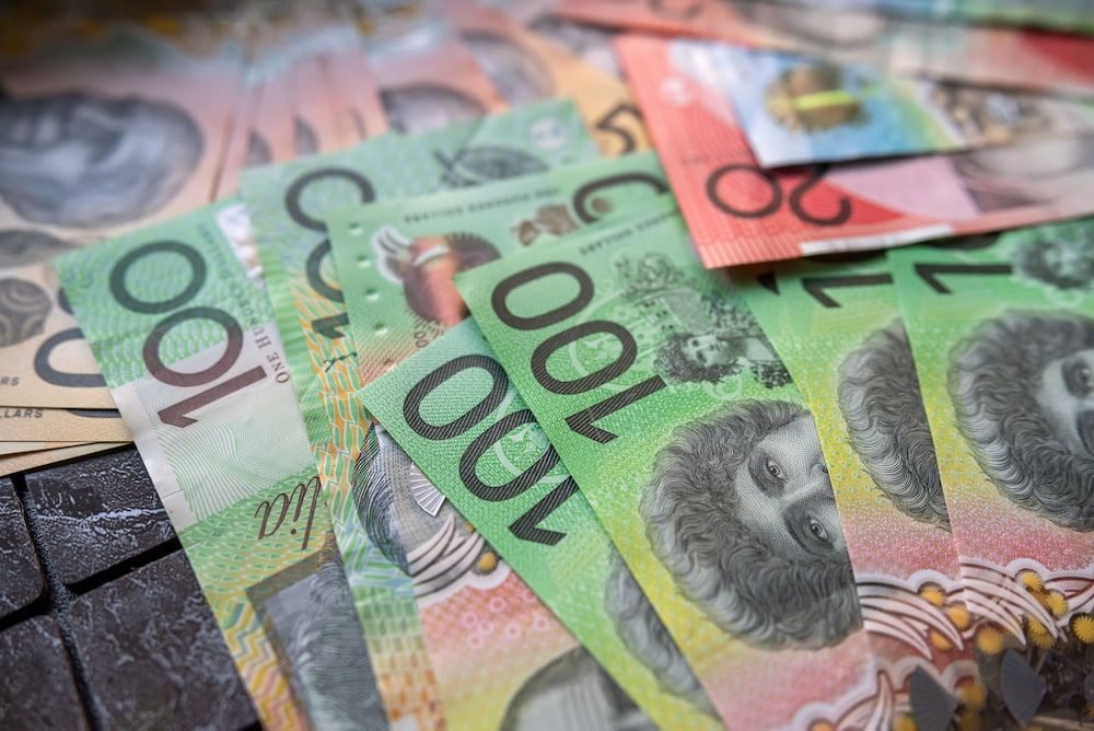 Australian banknotes fanned out, primarily green $100 bills, showing currency — Into Finance Lending Solutions in Harrington, NSW