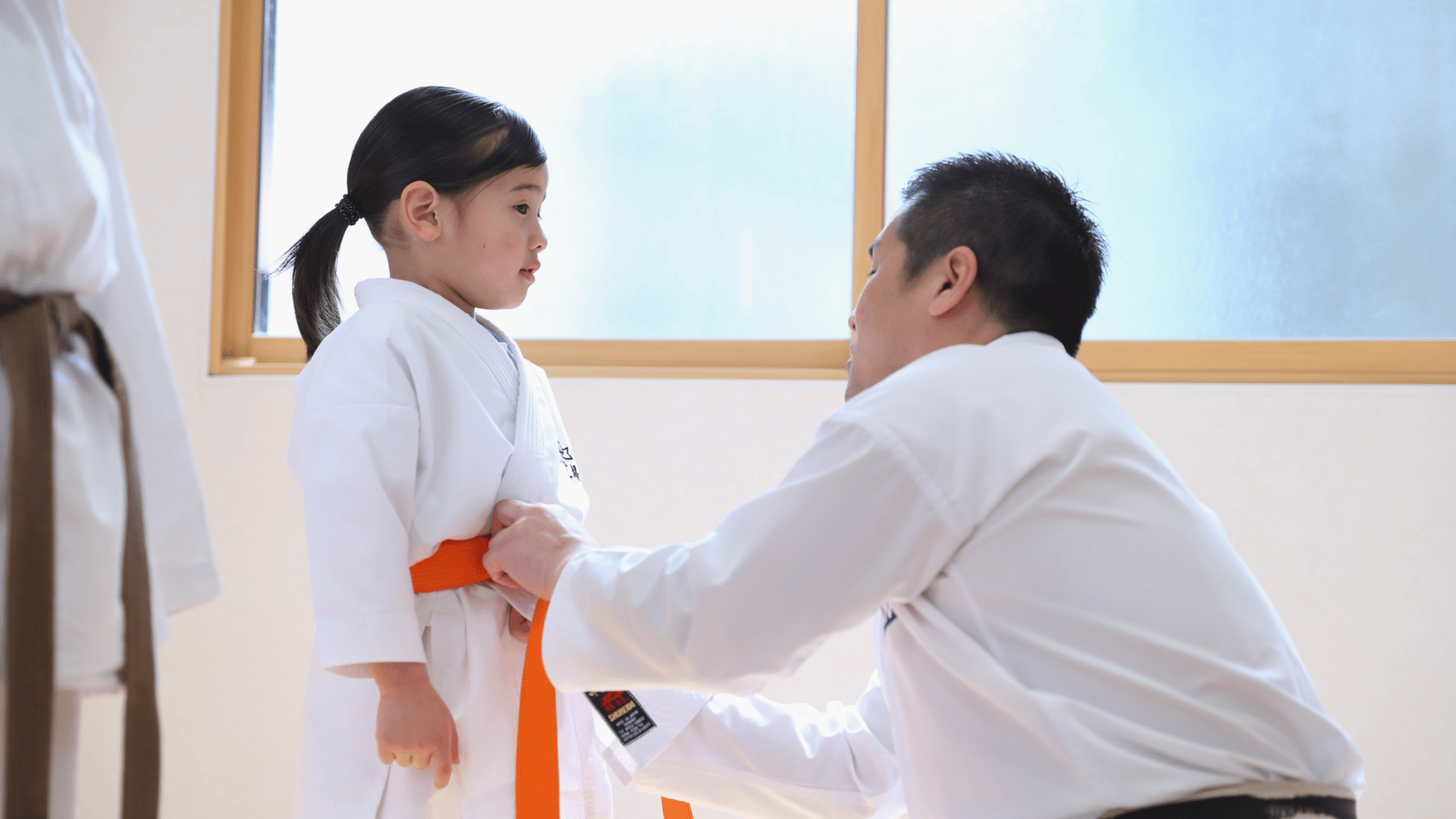 Adult martial arts zero experience students learning step by step with supportive beginner martial arts instruction