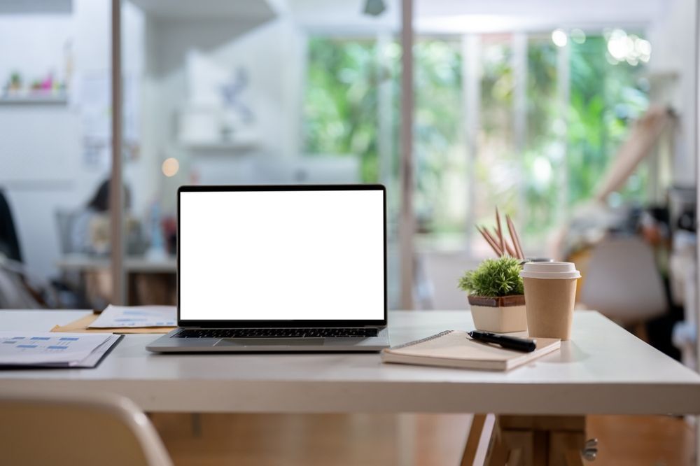 A Laptop Computer With A White Screen Is Sitting On A Desk — Black Label I.T. in Garbutt, QLD