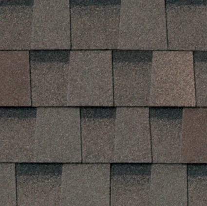 Close-up of asphalt roof shingles in varying shades of brown.