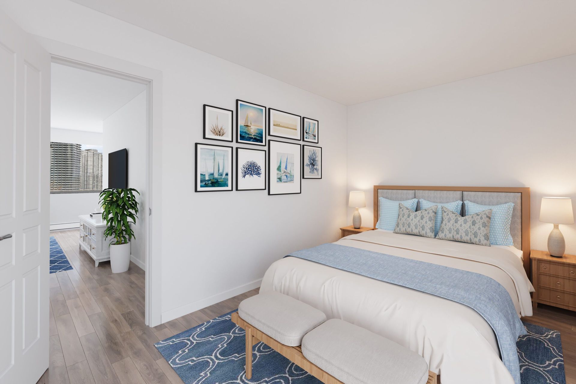 Bedroom with a bed, art, two lamps, and a view to another room. White walls with blue accents.