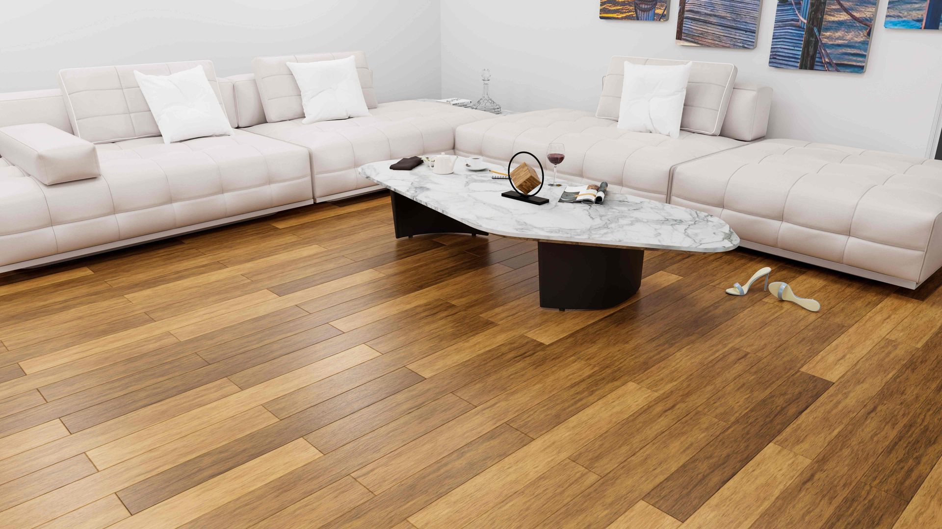 Modern living room with white sectional sofas, wooden floor, and a marble coffee table.
