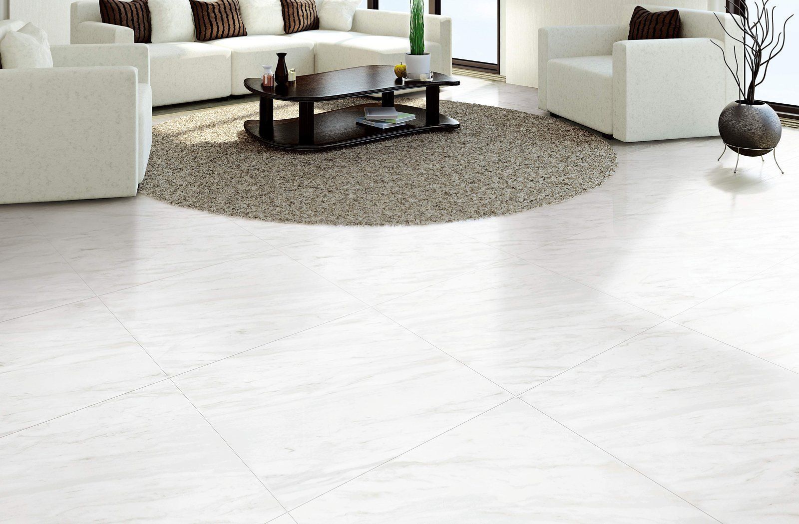 Modern living room with white sofas, a round rug, and a glass coffee table on a bright white floor