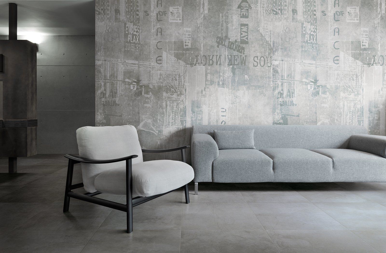 Minimalist living room with gray sofa, white chair, and textured gray wall