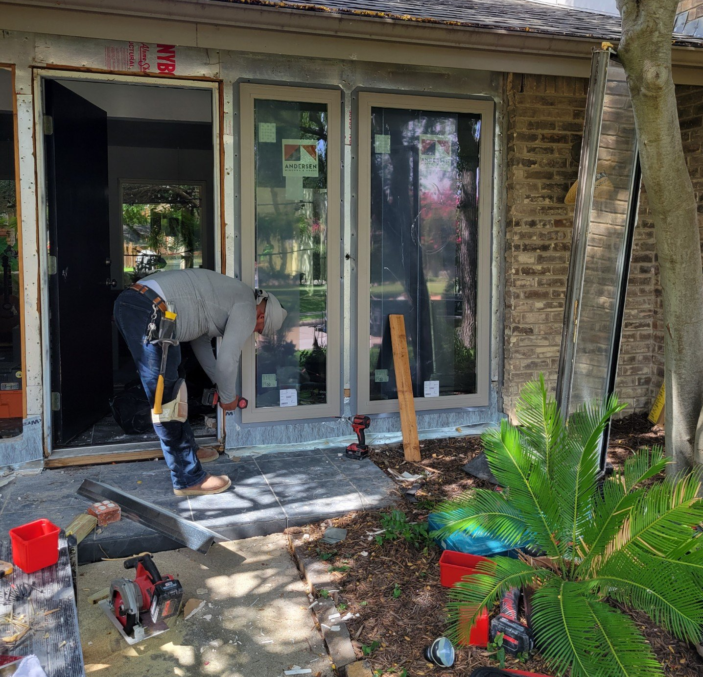 Andersen Architectural Front Door with 100 Series Sandtone Fixed Units Under Construction.