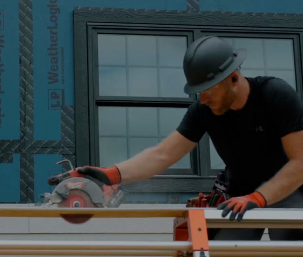 Cutting LP Siding for installation on a home in Dallas, Texas.