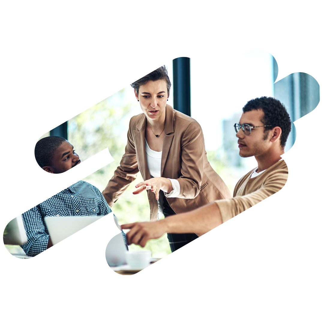 Three people in a business meeting, discussing a project.
