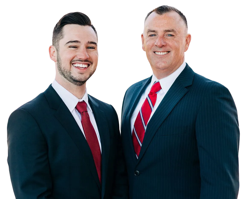 Two men in suits smiling, likely business professionals, with red ties.