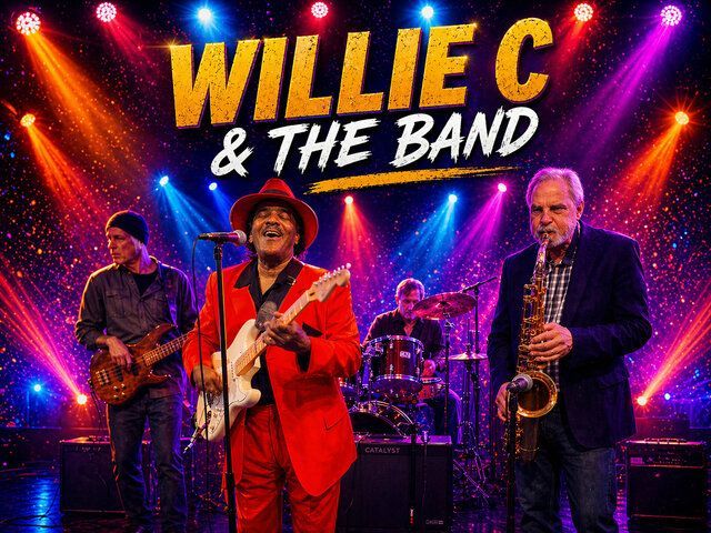 Willie C & The Band performing on a colorful stage with bright lights and instruments