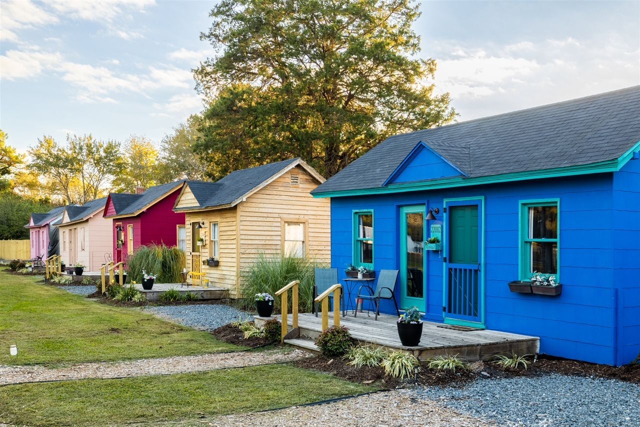 a row of colorful houses are lined up in a row .