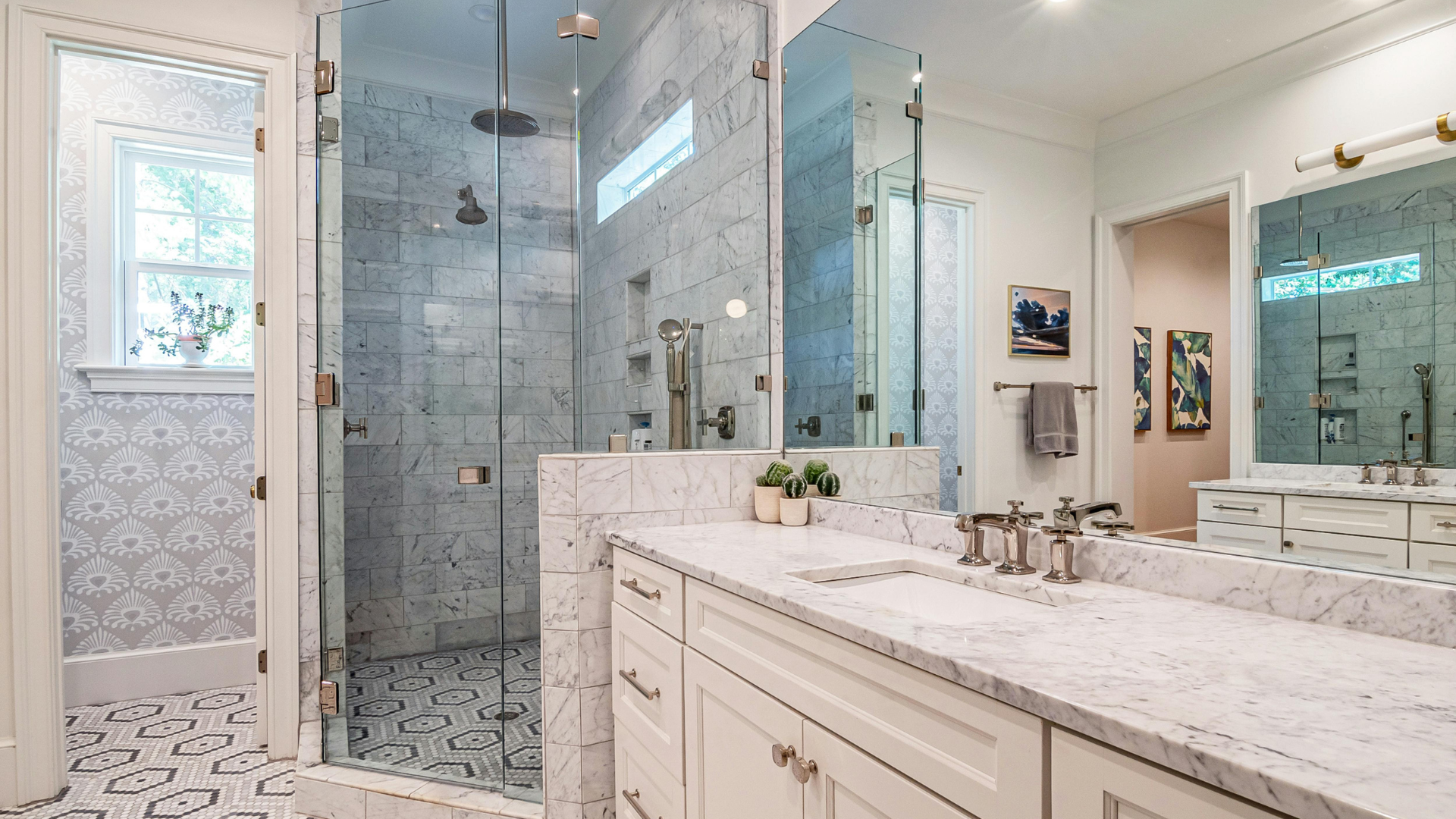 Finished bathroom with a clear glass shower enclosure