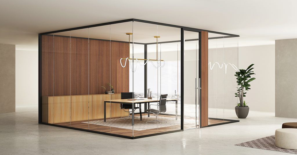 Demountable glass partitions forming a framed meeting room inside a flexible Tampa Bay office workspace