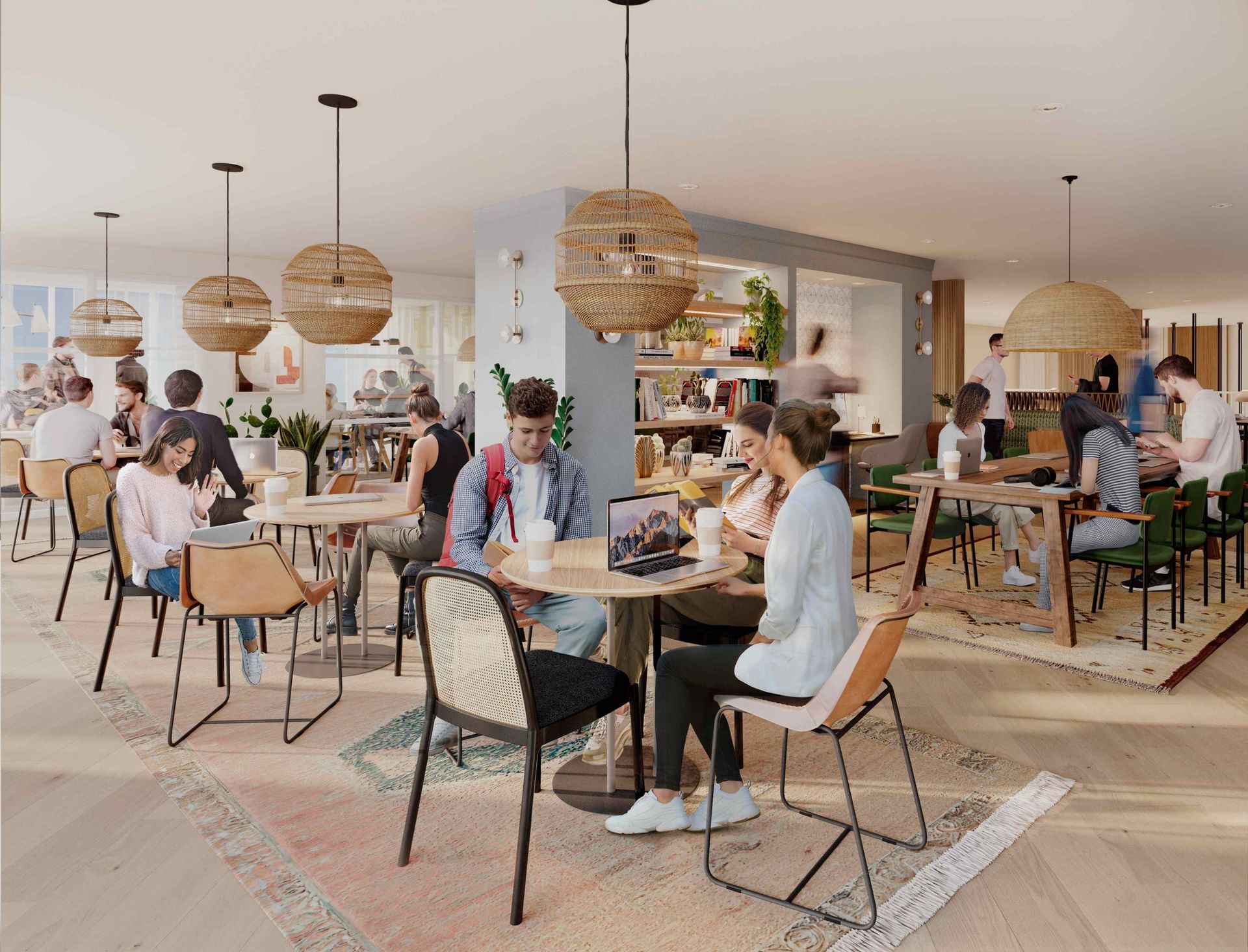 A bright, modern communal workspace with people sitting at round and rectangular tables, decorated with woven lamps.