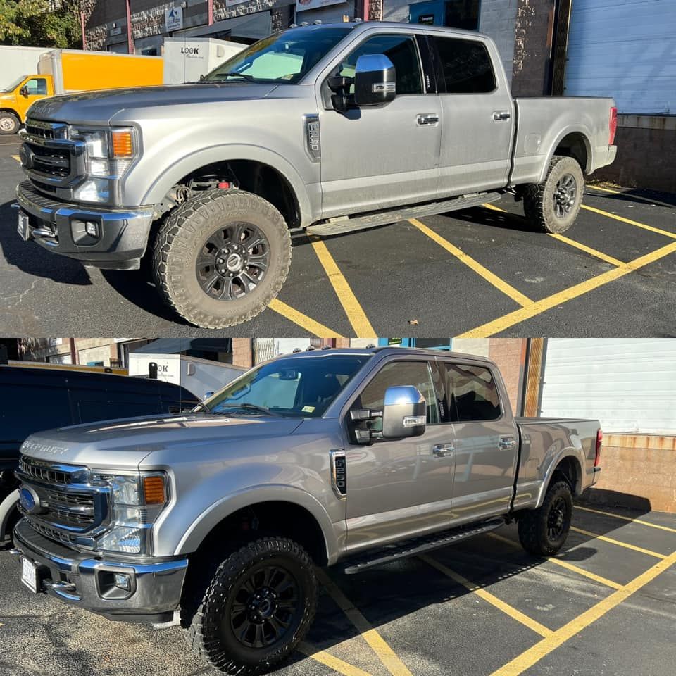 Two views of a silver lifted pickup truck parked in a marked lot, showing different wheel setups.