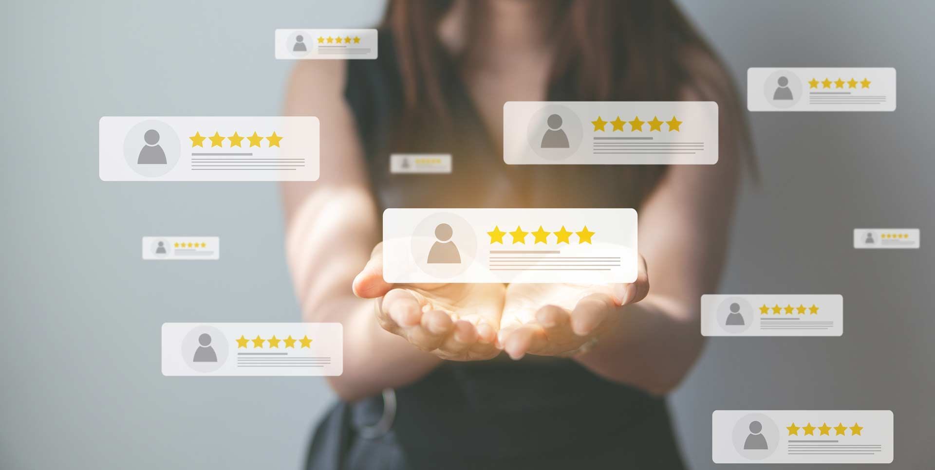 Woman holding glowing review boxes with star ratings, representing positive customer feedback