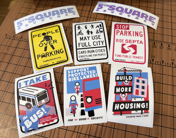 Collection of advocacy stickers promoting public transit, bike lanes, and housing, with a logo 