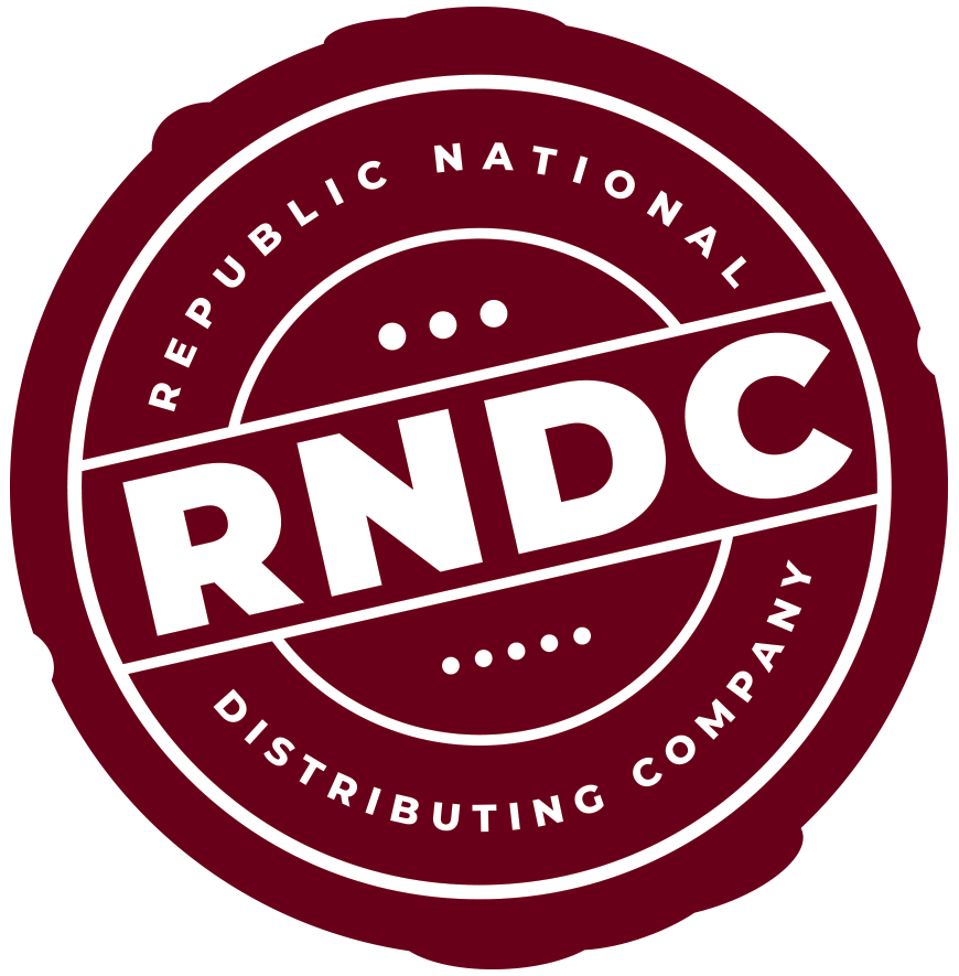 Maroon circular RNDC logo reading “Republic National Distributing Company” with bold white letters