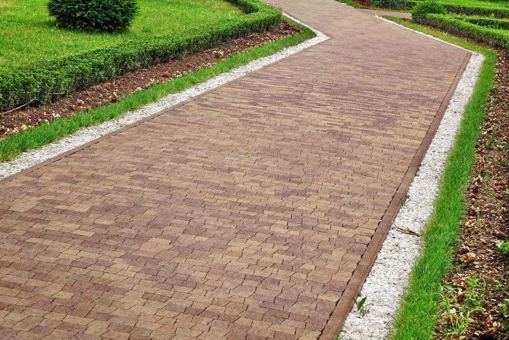 Ornamental Garden Landscape With Tiled Colourful Mosaic Paving and Marble White Gravel Along Walkway — D-Scapes Landscaping Services Pty Ltd in Taree, NSW