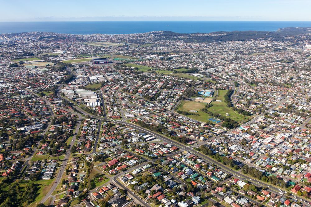 Aerial View of a Densely Populated City With Roads, Buildings — Topspin Tennis Newcastle in Lambton, NSW