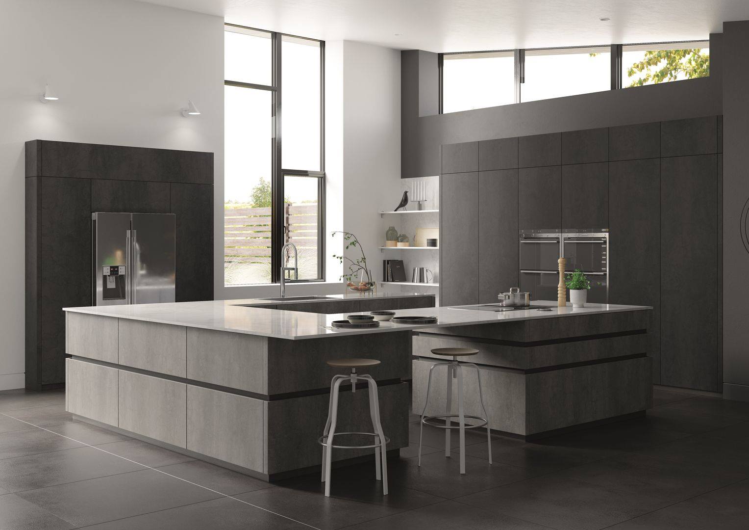A modern kitchen featuring grey cabinets, dual islands with light stone countertops, and two stools on a dark tile floor.