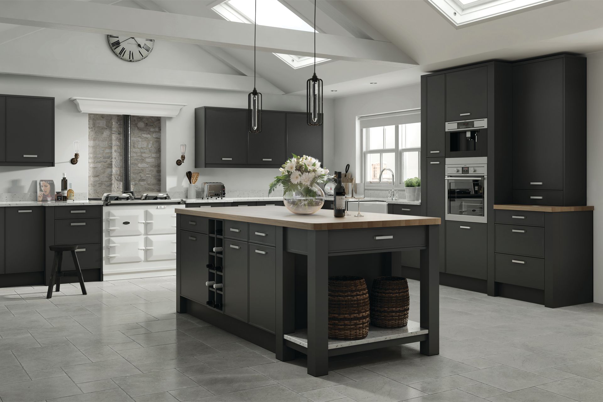 Modern kitchen with matte dark charcoal cabinets, a wooden kitchen island, and grey tile flooring under a vaulted ceiling.
