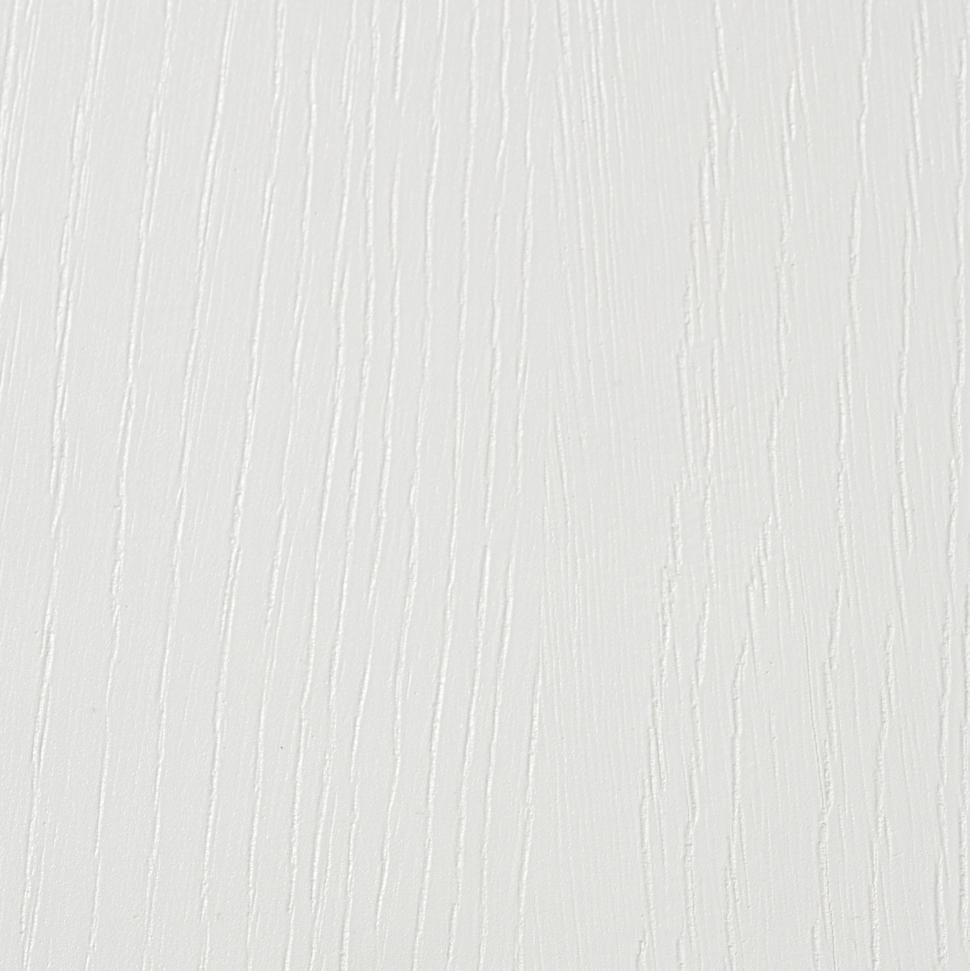 A close-up of a white textured surface with vertical, subtle grooves resembling wood grain.