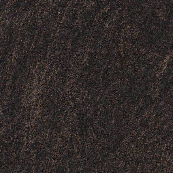 A close-up of dark brown, textured slate stone with a rough, layered surface.
