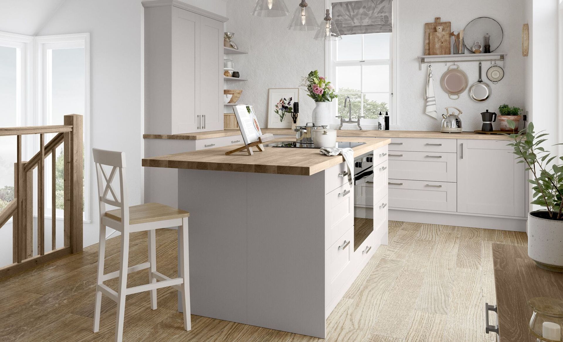 A bright, modern kitchen featuring a central island with a wood countertop, light gray cabinetry, and a wooden bar stool.