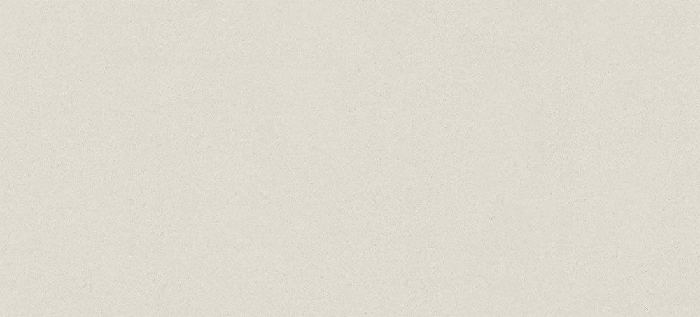 A plain, uniform light beige background with a subtle, fine-grained texture.