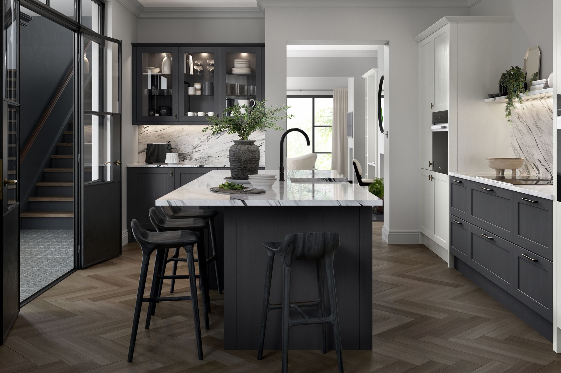 Modern black-and-white kitchen with island, bar stools, pendant lights, and herringbone wood floor.