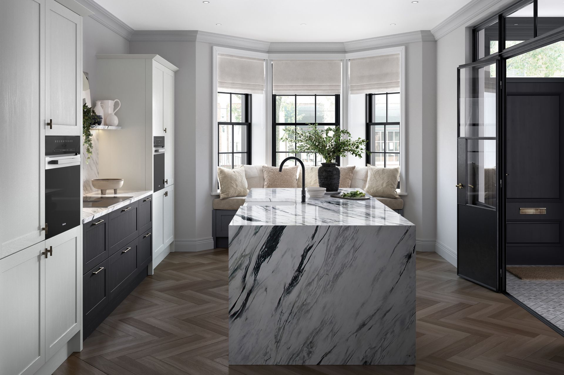 Bright modern kitchen with marble island, white cabinets, bay windows, and dark herringbone floor