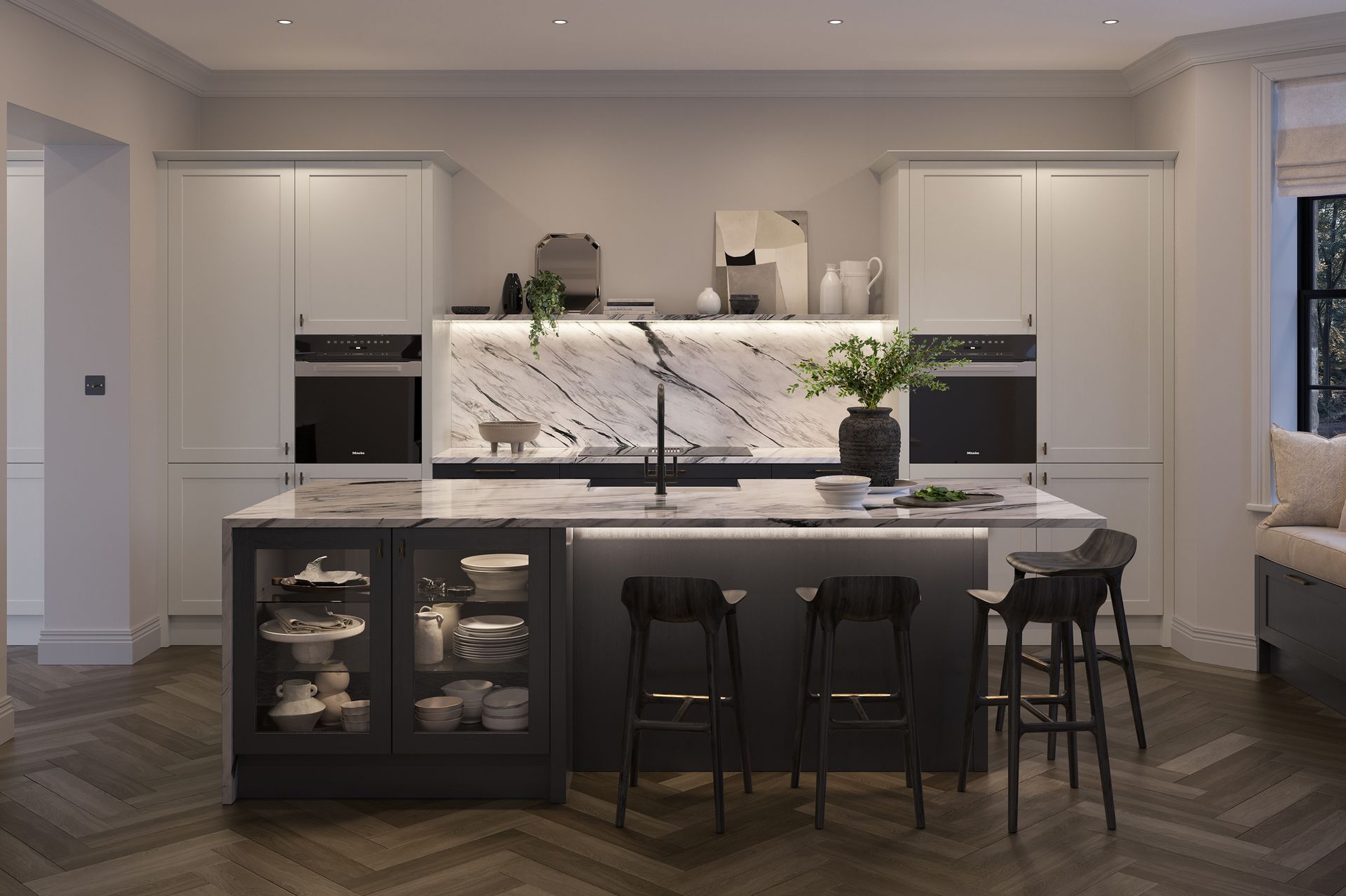 Modern white kitchen with marble island, black stools, and built-in cabinets in a spacious home interior