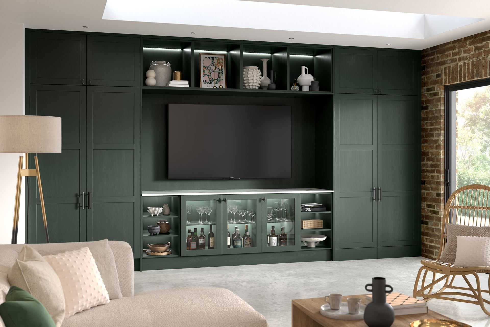 Modern living room with dark green built-in cabinets, a TV, display shelves, and a woven chair by the window