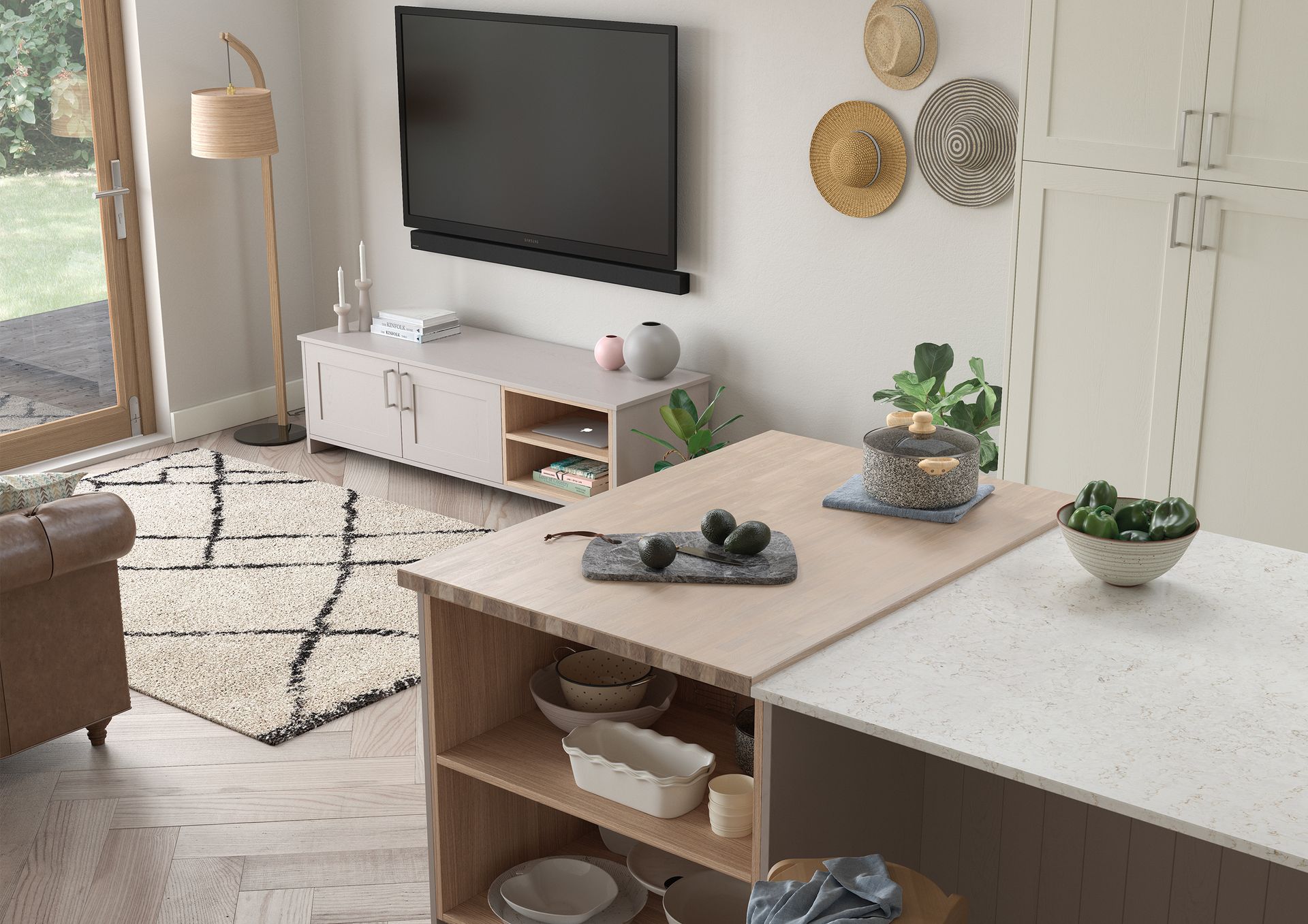 Bright modern living room with wall TV, beige sofa, rug, and white coffee table with plants