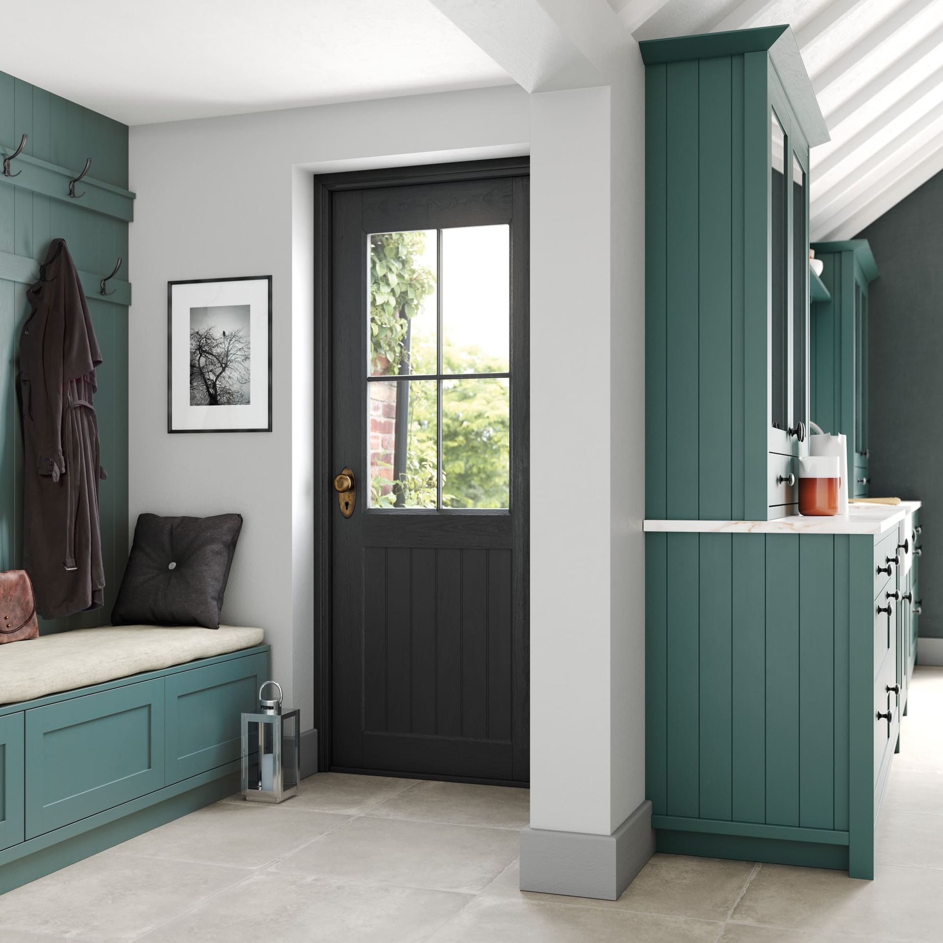 A mudroom with teal cabinets and bench, a central dark grey door, and white walls on a light stone floor.