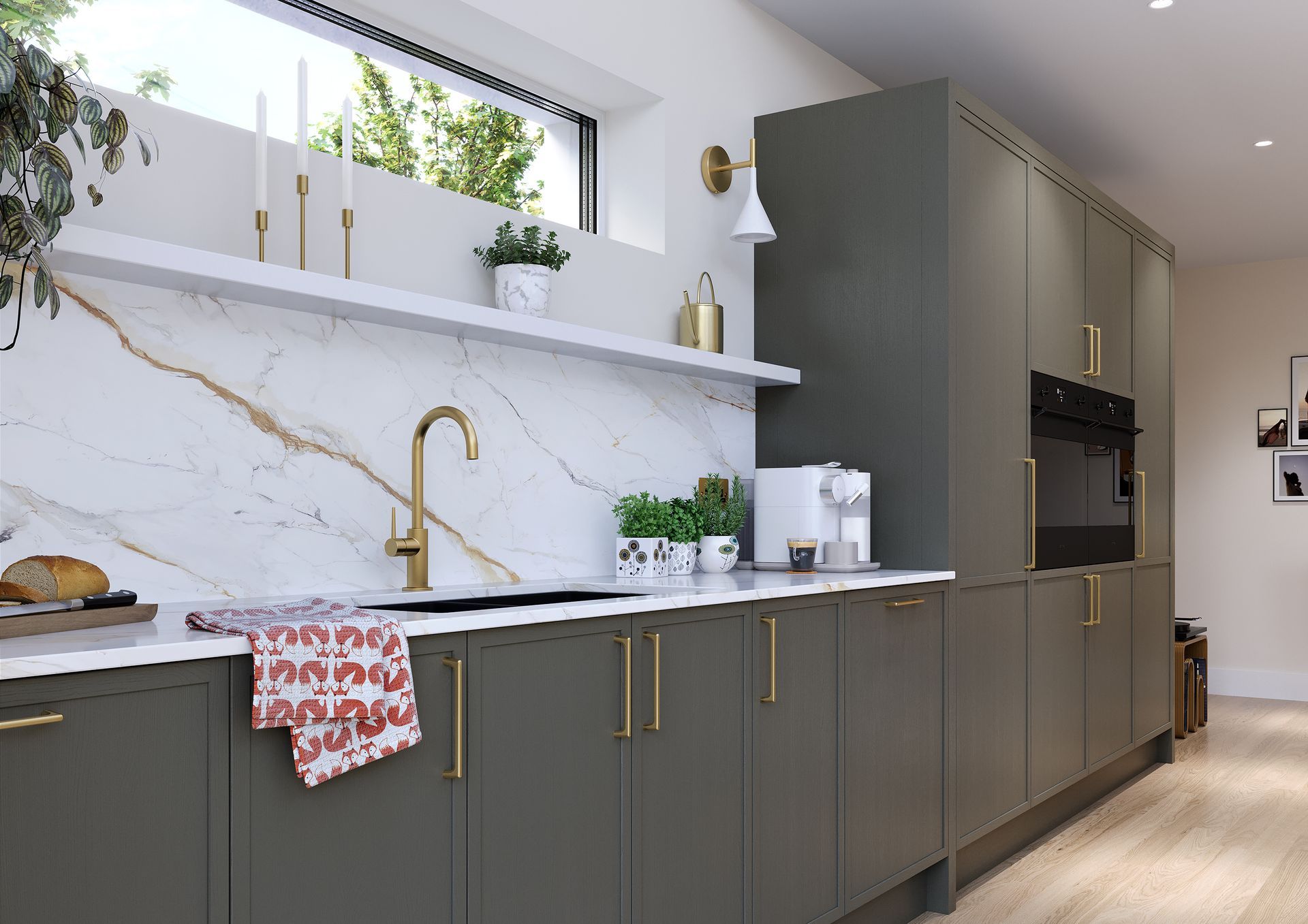 A modern kitchen featuring matte olive-green cabinets, a white marble backsplash, and gold fixtures under a narrow window.