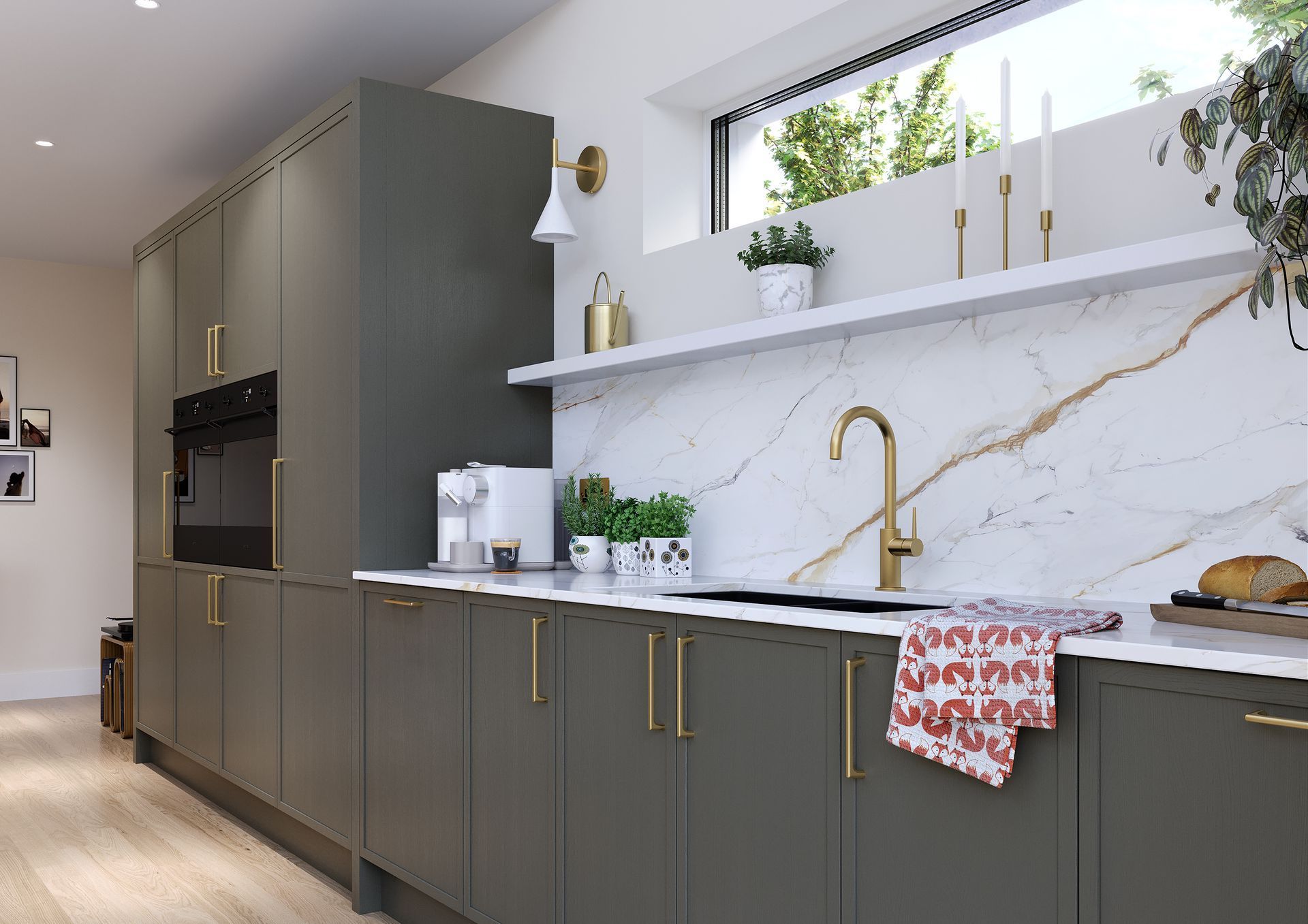 A modern kitchen featuring matte olive-green cabinets, a white marble backsplash, gold hardware, and a brass faucet.
