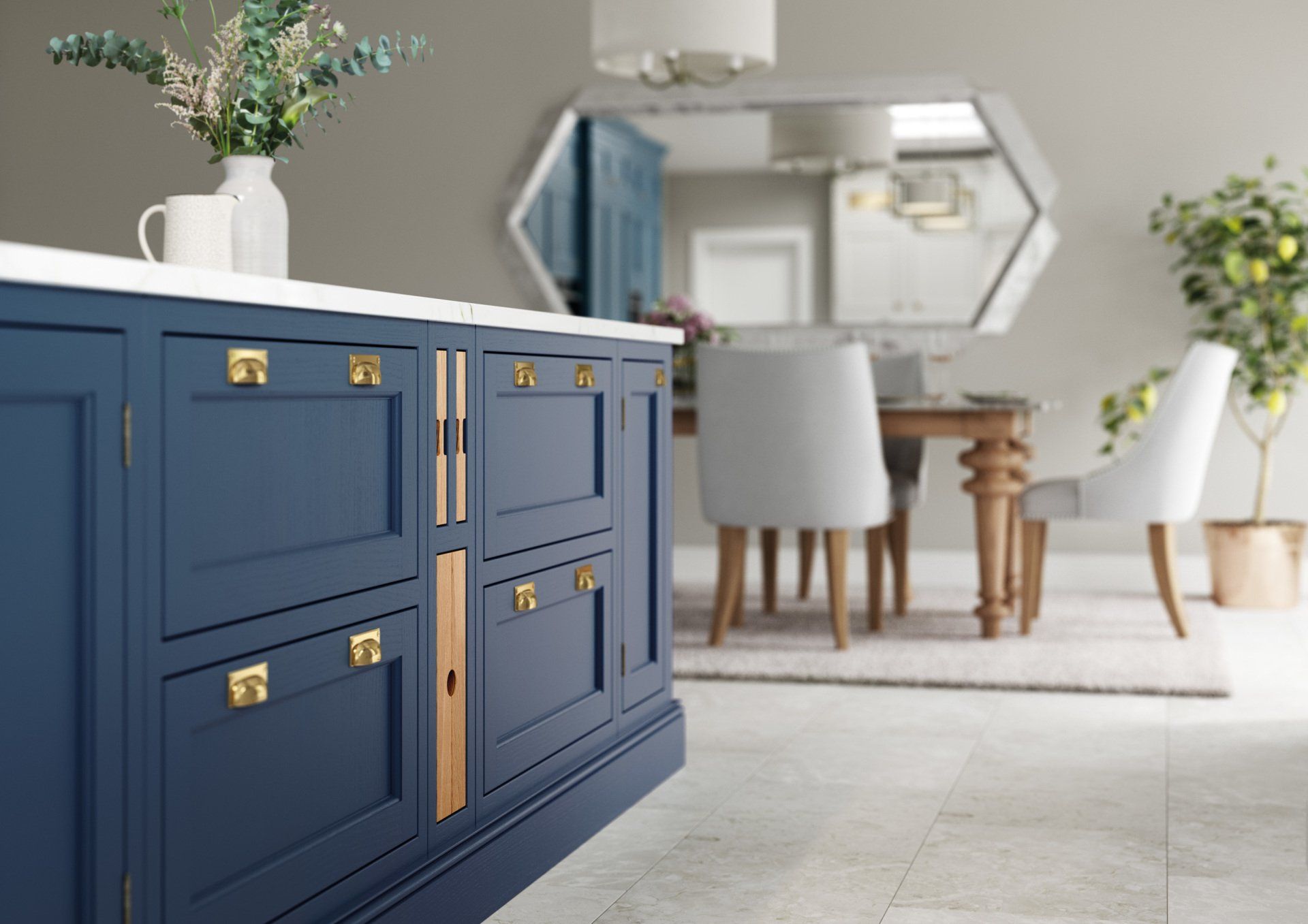 A dark blue kitchen island with gold hardware and a light wood detail, set against an out-of-focus dining room backdrop.