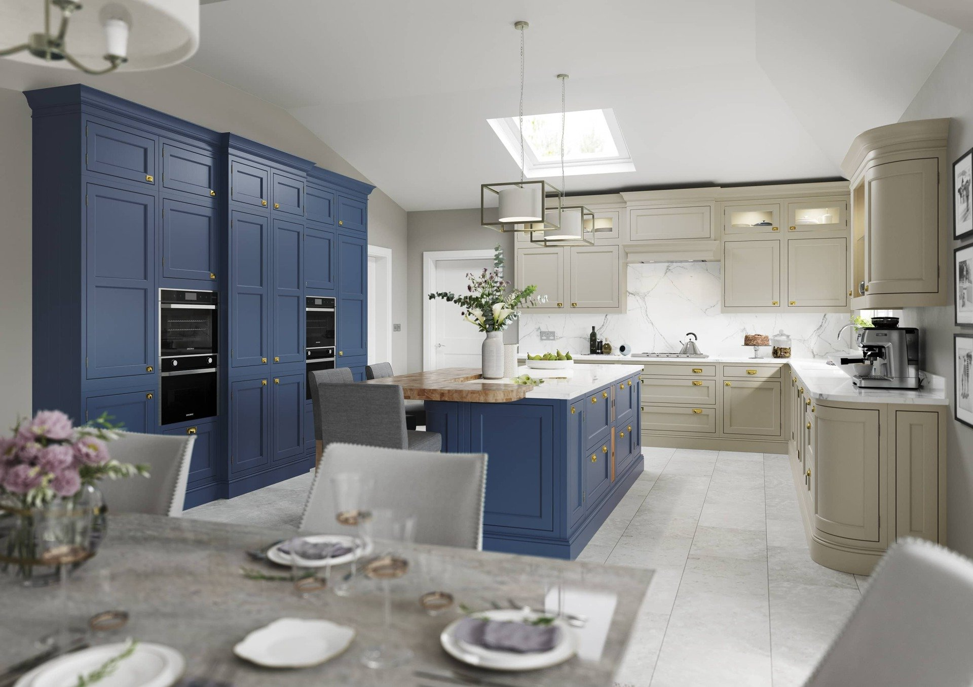 A spacious, modern kitchen featuring dark blue and light beige cabinetry, a central island, and a dining area in the front.