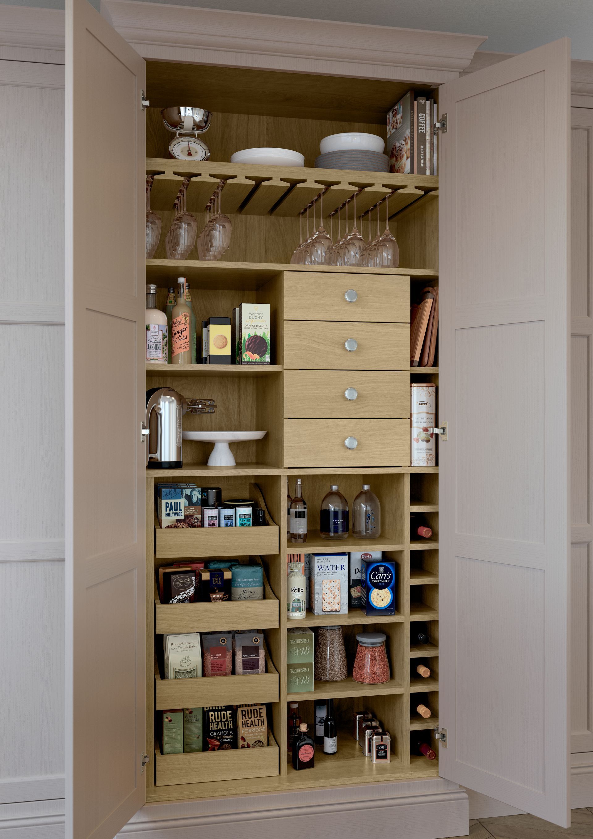 A light pink, double-door pantry cabinet with open shelves, drawers, a glass rack, and wine storage.