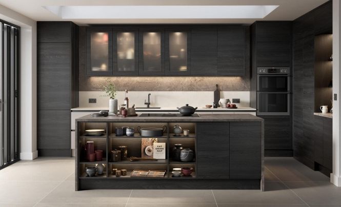 Modern kitchen with dark charcoal wood cabinets, a central island with open shelving, and a light-colored stone backsplash.
